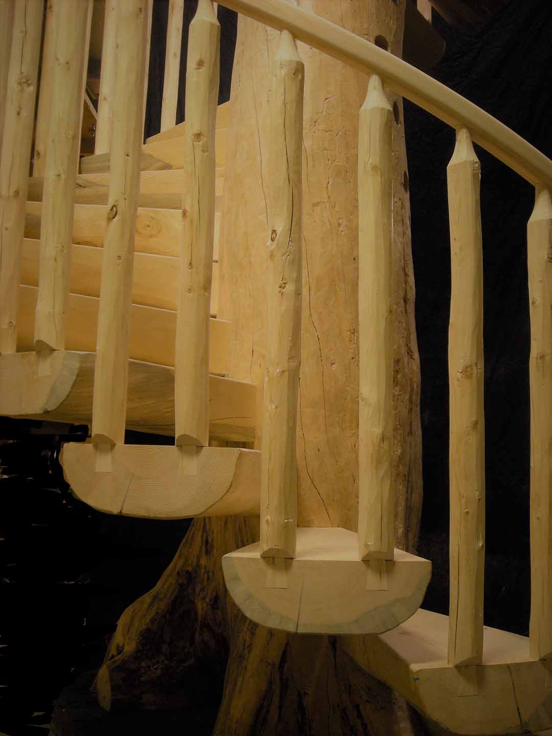 Custom Log Spiral Stairs with Dovetail Railing